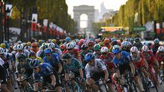 The pack rides on the Champs Elysees avenue with the Arc de Triomphe in the background during the 21st and last stage of the 107th edition of the Tour de France cycling race, 122 km between Mantes-la-Jolie and Champs Elysees Paris, on September 20, 2020. 
