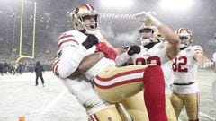 Jan 22, 2022; Green Bay, Wisconsin, USA; San Francisco 49ers kicker Robbie Gould (9) celebrates with teammate after kicking the game winning field goal during a NFC Divisional playoff football game against the Green Bay Packers at Lambeau Field. Mandatory