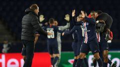 This handout photograph taken and released by the UEFA on March 11, 2020, shows  Paris Saint-Germain&#039;s Paris Saint-Germain&#039;s French forward Kylian Mbappe (R) and Paris Saint-Germain&#039;s German coach Thomas Tuchel   celebrating after winning t