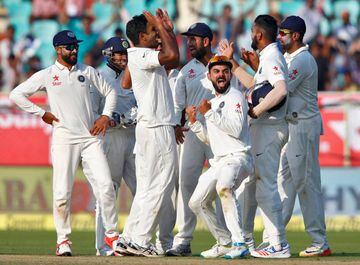 India's players celebrate the dismissal of England's Moeen Ali.