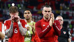 Soccer Football - FIFA World Cup Qatar 2022 - Group B - Wales v England - Ahmad Bin Ali Stadium, Al Rayyan, Qatar - November 29, 2022 Wales' Gareth Bale and Joe Rodon look dejected after the match as Wales are eliminated from the World Cup REUTERS/Lee Smith     TPX IMAGES OF THE DAY