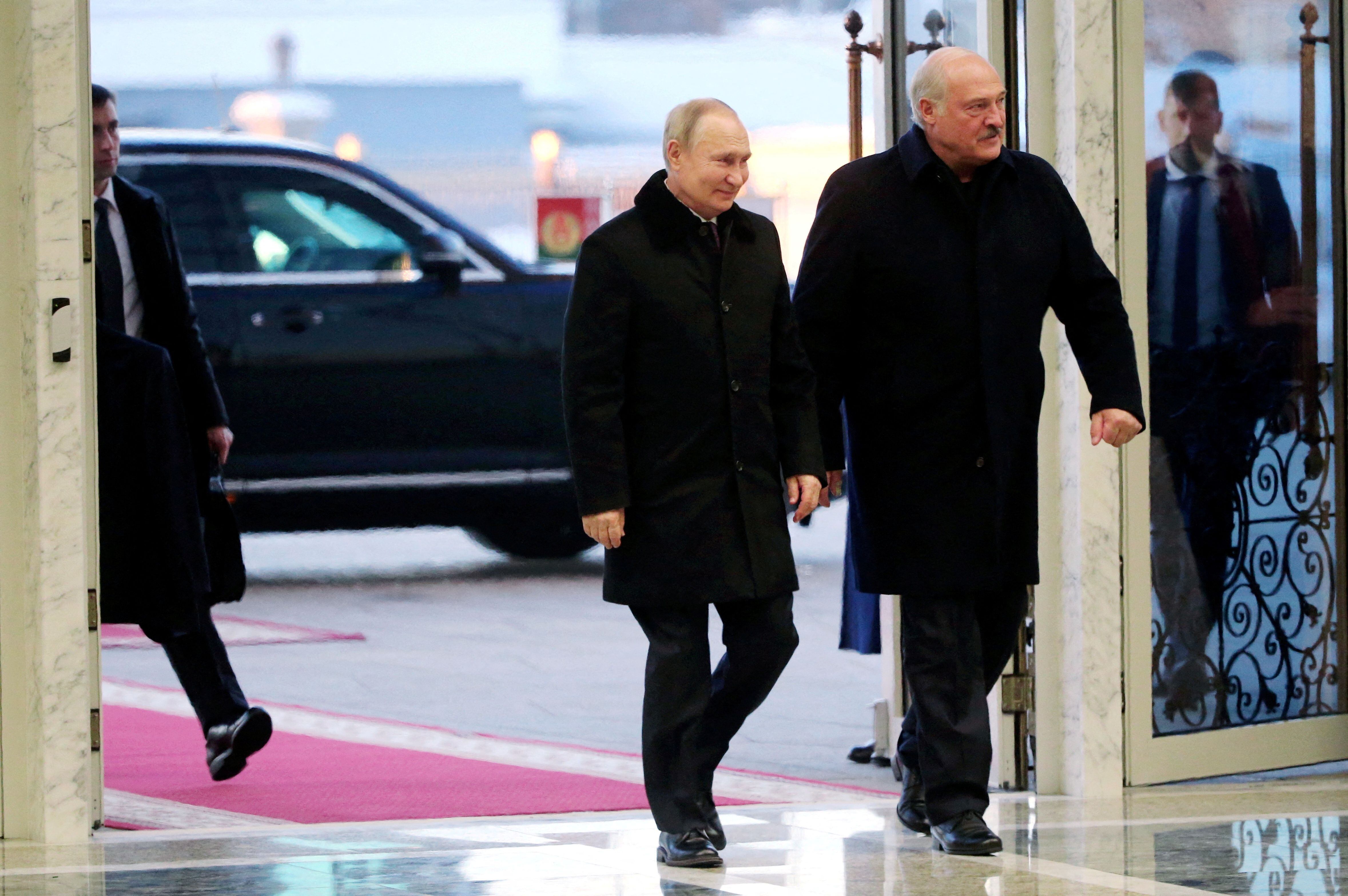 FILE PHOTO: Russian President Vladimir Putin and Belarusian President Alexander Lukashenko arrive for a meeting at the Palace of Independence in Minsk, Belarus December 19, 2022. Sputnik/Konstantin Zavrazhin/Pool via REUTERS ATTENTION EDITORS - THIS IMAGE WAS PROVIDED BY A THIRD PARTY./File Photo