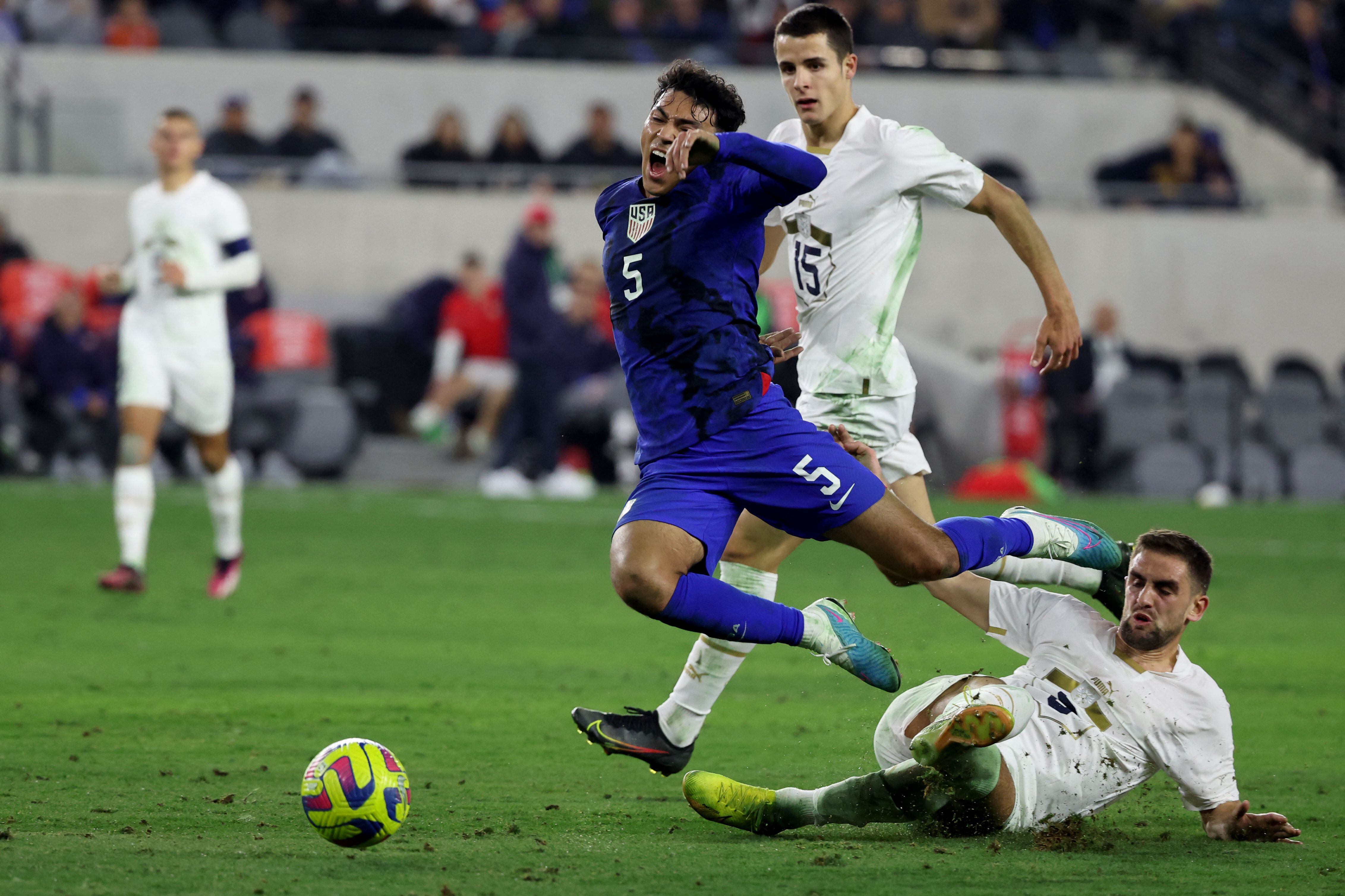 Jan 25, 2023; Los Angeles, California, USA;  USA defender Jonathan Gomez (5) is fouled by Serbia defender Marko Mijailovic (5) during the second half at BMO Stadium. Mandatory Credit: Kiyoshi Mio-USA TODAY Sports