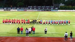 Players observe a minute&#039;s silence for Arshad Khamis in Singapore. 