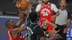 Toronto Raptors&#039; Serge Ibaka, left, battles for the ball with Boston Celtics&#039; Jaylen Brown (7) and Boston Celtics&#039; Jayson Tatum, right, during the first half of an NBA conference semifinal playoff basketball game Monday, Sept. 7, 2020, in L