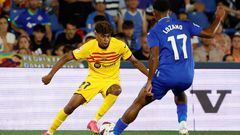 Barcelona's Spanish forward #27 Lamine Yamal vies with Getafe's Honduran forward #17 Anthony Lozano during the Spanish Liga football match between Getafe CF and FC Barcelona at the Col. Alfonso Perez stadium in Getafe on August 13, 2023. (Photo by JAVIER SORIANO / AFP)