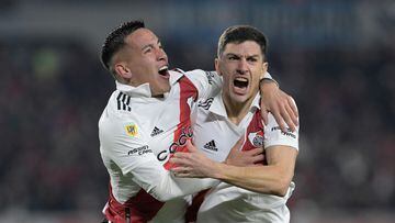 River Plate's midfielder Ignacio Fernandez (R) celebrates with teammate midfielder Ezequiel Barco after scoring the team's second goal against Instituto during the Argentine Professional Football League match at the Monumental stadium in Buenos Aires, on June 22, 2023. (Photo by JUAN MABROMATA / AFP)