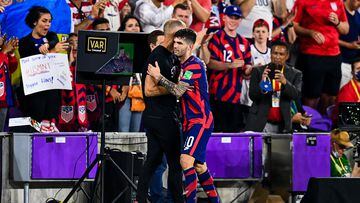 USA's Christian Pulisic (R) hugs USA's Head Coach Gregg Berhalter during US Men�s National Team�s 2022 FIFA World Cup Qualifier vs. Panama at Exploria Stadium in Orlando, Florida on March 27, 2022. (Photo by CHANDAN KHANNA / AFP)