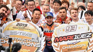 Japanese Grand Prix winner Repsol Honda Team rider Marc Marquez of Spain (front C) celebrates with his team officers at the parc ferme after the MotoGP class Japanese Motorcyle Grand Prix at the Twin Ring Motegi circuit in Motegi, Tochigi prefecture on Oc
