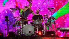 British singer Chris Martin (L) and drummer Will Champion (R) of British band Coldplay perform on the main stage during Rock in Rio music festival at Rio 2016 Olympic Park in Rio de Janeiro, Brazil, on September 11, 2022. (Photo by MAURO PIMENTEL / AFP) (Photo by MAURO PIMENTEL/AFP via Getty Images)