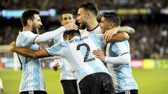 Gabriel Mercado celebrates with Leo Messi