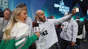 ST PAUL, MN - JANUARY 29: Julie Ertz of the USA women&#039;s national soccer team and wife of Zach Ertz #86 of the Philadelphia Eagles poses for a selfie with Jordan Hicks #58 and Chris Maragos #42 of the Philadelphia Eagles during Super Bowl Media Day at