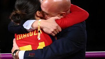 Spain's midfielder Claudia Zornoza #21 is congratuled by President of the Royal Spanish Football Federation Luis Rubiales (R) after winning the Australia and New Zealand 2023 Women's World Cup final football match between Spain and England at Stadium Australia in Sydney on August 20, 2023. The Spanish football federation (RFEF) on August 26, 2023 threatened to take legal action over Women's World Cup player Jenni Hermoso's "lies" about her kiss with its president Luis Rubiales. (Photo by FRANCK FIFE / AFP)
