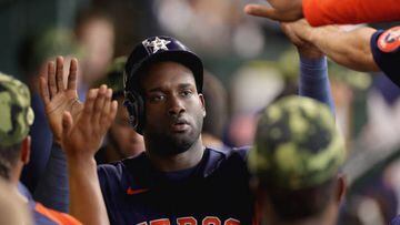 HOUSTON, TEXAS - MAY 22: Yordan Alvarez #44 of the Houston Astros high fives teammates after being driven in on a double hit by Yuli Gurriel #10 during the fifth inning against the Texas Rangers at Minute Maid Park on May 22, 2022 in Houston, Texas. (Photo by Carmen Mandato/Getty Images)