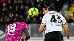 Juventus' Italian forward Moise Kean (L) and Spezia's Greek defender Dimitrios Nikolaou go for a header during the Italian Serie A football match between Spezia and Juventus, on February 19, 2023 at the Alberto-Picco stadium in La Spezia. (Photo by ANDREAS SOLARO / AFP) (Photo by ANDREAS SOLARO/AFP via Getty Images)