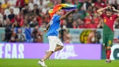 LUSAIL CITY, QATAR - NOVEMBER 28: A protester on the pitch with rainbow flag during the FIFA World Cup Qatar 2022 Group H match between Portugal and Uruguay at Lusail Stadium on November 28, 2022 in Lusail City, Qatar. (Photo by Manuel Reino Berengui/DeFodi Images via Getty Images)