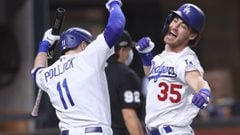 Cody Bellinger of the Los Angeles Dodgers is congratulated by A.J. Pollock after hitting a solo home run against the Atlanta Braves during the seventh inning in Game Seven of the National League Championship Series at Globe Life Field on October 18, 2020 