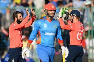England bowler Moeen Ali celebrates with wicketkeeper Jos Buttler after dismissing Afghanitan's Rashid Khan