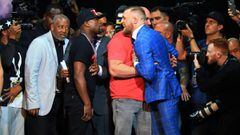 TORONTO, ON - JULY 12: Floyd Mayweather Jr. and Conor McGregor faceoff during the Floyd Mayweather Jr. v Conor McGregor World Press Tour at Budweiser Stage on July 12, 2017 in Toronto, Canada.   Vaughn Ridley/Getty Images/AFP == FOR NEWSPAPERS, INTERNET,