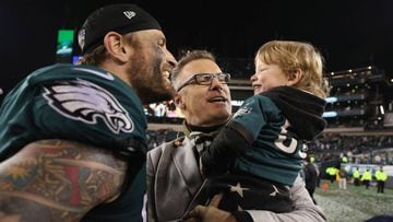 PHILADELPHIA, PA - JANUARY 21: Chris Long #56 of the Philadelphia Eagles celebrates with his son Waylon James Long and his father and former NFL player Howie Long after defeating the Minnesota Vikings in the NFC Championship game at Lincoln Financial Fiel