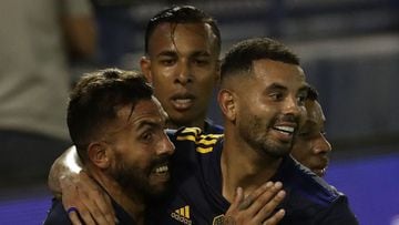 Boca Juniors&#039; forward Carlos Tevez (L) celebrates with teammates after scoring the team&#039;s fifth goal against Velez Sarsfield during their Argentine Professional Football League match at La Bombonera stadium in Buenos Aires, on March 7, 2021. (Photo by ALEJANDRO PAGNI / AFP)
