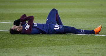 Paris Saint-Germain's Brazilian forward Neymar Jr reacts in pain after an injury during the French L1 football match between Paris Saint-Germain (PSG) and Marseille (OM) at the Parc des Princes in Paris on February 25, 2018.ELT