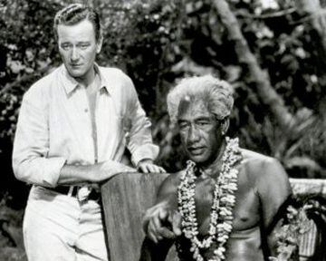 Duke Kahanamoku and John Wayne in the film "Wake of the Red Witch" in 1948. Duke lived for a time in Southern Californa and was an actor and an extra in a number of films. He used his Hollywood contacts to promote surfing.