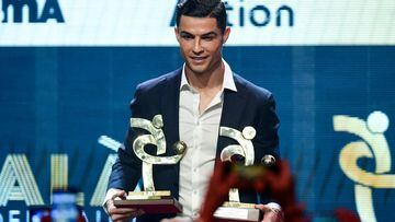 In this file photo Cristiano Ronaldo receives the award of for Serie A player of the year. US district judge, Judge Jennifer Dorsey, has dismissed a rape lawsuit against Ronaldo, castigating the legal team behind the complaint. Dorsey threw out the case brought by Kathryn Mayorga of Nevada, who alleged she was assaulted by the Portuguese soccer star in a Las Vegas hotel room in 2009.