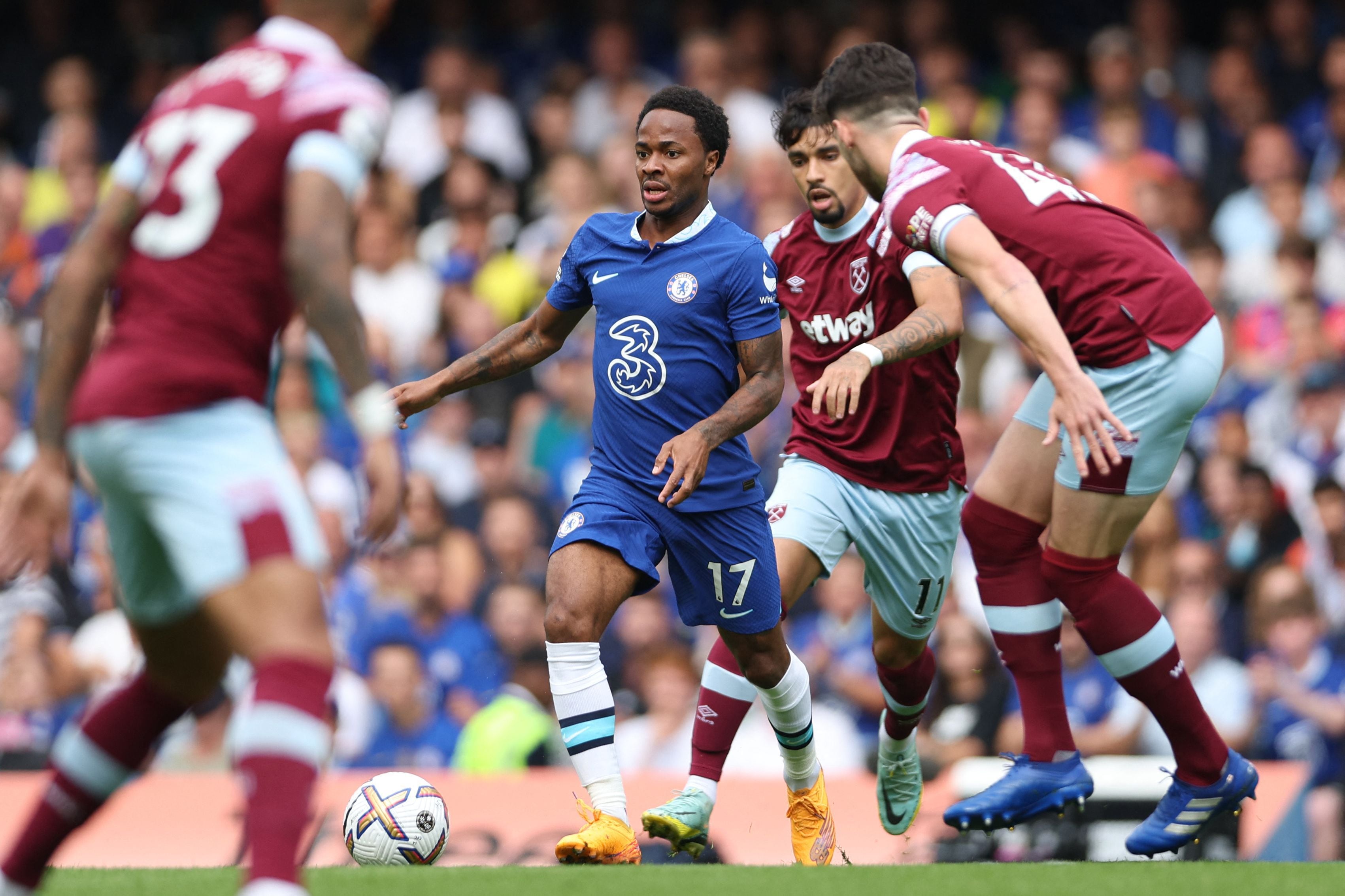 Chelsea's English midfielder Raheem Sterling controls the ball during the English Premier League football match between Chelsea and West Ham United at Stamford Bridge in London on September 3, 2022. (Photo by Adrian DENNIS / AFP) / RESTRICTED TO EDITORIAL USE. No use with unauthorized audio, video, data, fixture lists, club/league logos or 'live' services. Online in-match use limited to 120 images. An additional 40 images may be used in extra time. No video emulation. Social media in-match use limited to 120 images. An additional 40 images may be used in extra time. No use in betting publications, games or single club/league/player publications. / 