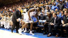 DURHAM, NORTH CAROLINA - FEBRUARY 20: Zion Williamson #1 of the Duke Blue Devils walks to the bench after falling as his shoe breaks against Luke Maye #32 of the North Carolina Tar Heels during their game at Cameron Indoor Stadium on February 20, 2019 in 