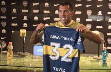 Boca Juniors' newly returned player Carlos Tevez poses with his new jersey during his official presentation at Los Cardales, Buenos Aires province, on January 09, 2018.