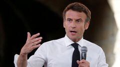 FILE PHOTO: French President Emmanuel Macron, candidate for his re-election in the 2022 French presidential election, delivers a speech during a campaign rally in Figeac on the last day of campaigning, ahead of the second round of the presidential electio
