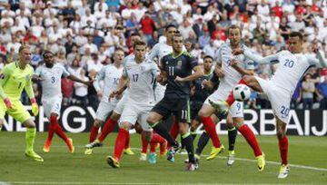 Dele Alli (right) looks to clear for England.