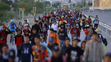 Migrants seeking asylum in the United States walk on the banks of the Rio Bravo river, the border between the U.S. and Mexico, after being stranded near the city Villa Ahumada, in Ciudad Juarez, Mexico, September 30, 2023. REUTERS/Jose Luis Gonzalez