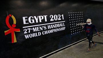 FILE PHOTO: An Egyptian employee wearing a protective face mask works on the New Capital Stadium that will host the IHF Handball World Championship in January 2021 in the New Administrative Capital (NAC), east of Cairo, amid concerns about the spread of t