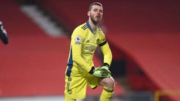Manchester United's Spanish goalkeeper David de Gea reacts after conceding their first goal during the English Premier League football match between Manchester United and Aston Villa at Old Trafford in Manchester, north west England, on January 1, 2021. (