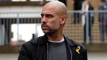 Guardiola charged for wearing politically-loaded yellow ribbon