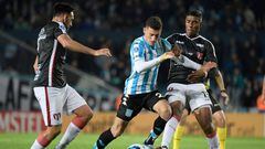Argentina's Racing Tomas Chancalay (C) and Uruguay's River Plate Marcos Montiel (R) vie for the ball during their Copa Sudamericana group stage football match at the Presidente Juan Domingo Peron stadium in Avellaneda, Buenos Aires Province, Argentina, on May 26, 2022. (Photo by Juan Mabromata / AFP) (Photo by JUAN MABROMATA/AFP via Getty Images)