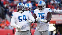 Dec 12, 2021; Denver, Colorado, USA; Detroit Lions defensive tackle Alim McNeill (54) and defensive end Levi Onwuzurike (75) react to a sack in the second quarter against the Denver Broncos at Empower Field at Mile High. Mandatory Credit: Ron Chenoy-USA T