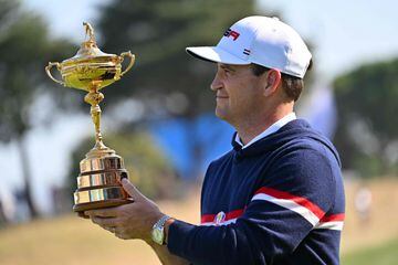 US captain Zach Johnson holds the trophy as he poses at the official team portraits ahead of the Ryder Cup.