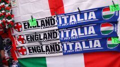 Soccer Football - Euro 2020 - Fans gather for Italy v England - Wembley Stadium, London, Britain - July 11, 2021 England and Italy flags are seen with scarves on display outside Wembley stadium ahead of the match Action Images via Reuters/Carl Recine