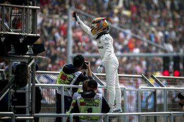 Lewis Hamilton celebrates taking pole.