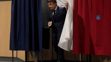 French President Emmanuel Macron walks out of a voting booth during the final round of the country's parliamentary elections, in Le Touquet, France June 19, 2022 Michel Spingler/Pool via REUTERS
