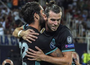 Bale (right) celebrates with Isco after setting the Spaniard up to double Real Madrid's lead in Skopje.
