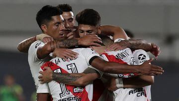 River Plate&#039;s defender Gonzalo Montiel (hidden) celebrates with teammates after scoring, by penalty kick, the team&#039;s second goal against Rosario Central during an Argentine Professional Football League match, at the Monumental stadium in Buenos Aires, on February 20, 2021. (Photo by ALEJANDRO PAGNI / AFP)