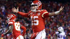 KANSAS CITY, MISSOURI - JANUARY 23: Patrick Mahomes #15 of the Kansas City Chiefs celebrates a touchdown scored by Tyreek Hill #10 against the Buffalo Bills during the fourth quarter in the AFC Divisional Playoff game at Arrowhead Stadium on January 23, 2