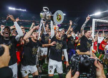 Valencia's players celebrate winning the Copa del Rey final with trophy.