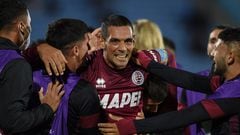 Argentina's Lanus Jose Sand celebrates with his teammates after scoring a goal against Uruguay's Montevideo Wanderers during their Copa Sudamericana group stage football match at the Centenario stadium in Montevideo, on April 28, 2022. (Photo by DANTE FERNANDEZ / AFP)