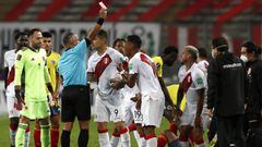 LIMA, PERU - JUNE 03: Referee Wilton Sampaio shows a red card to Miguel Trauco of Peru during a match between Peru and Colombia as part of South American Qualifiers for Qatar 2022 at Estadio Nacional de Lima on June 03, 2021 in Lima, Peru. (Photo by Paolo