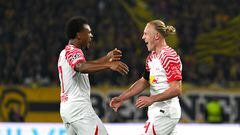 RB Leipzig's Austrian midfielder #24 Xaver Schlager (R) celebrates with RB Leipzig's Belgian forward #17 Lois Openda after scoring his team's second goal during the UEFA Champions League Group G football match between Young Boys and Leipzig at The Wankdorf Stadium in Bern on September 19, 2023. (Photo by Fabrice COFFRINI / AFP)